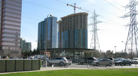 The passenger pick-up area at Finch subway station, with high-rise buildings behind it.